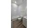 Well-lit bathroom featuring a tub/shower combo, modern vanity, and stylish flooring at 612 Sears Ne Ave, Winter Haven, FL 33881