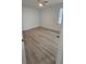 A light filled bedroom with luxury vinyl plank flooring and a ceiling fan at 612 Sears Ne Ave, Winter Haven, FL 33881