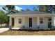 Charming single-story home with a covered porch and stone accents under the columns at 612 Sears Ne Ave, Winter Haven, FL 33881
