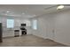 A well lit open kitchen featuring stainless steel appliances and an adjacent living space at 612 Sears Ne Ave, Winter Haven, FL 33881