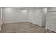 Bright living room features modern, neutral walls and luxury vinyl plank flooring at 612 Sears Ne Ave, Winter Haven, FL 33881