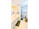 Bright bathroom with vanity and shower with curtains at 6305 Bayberry Ne Blvd, Winter Haven, FL 33881