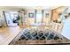 Charming dining area with room for four, adjacent to living space, and a display cabinet at 6305 Bayberry Ne Blvd, Winter Haven, FL 33881