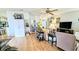 Bright living room features a ceiling fan, light wood floors, and a comfortable seating arrangement at 6305 Bayberry Ne Blvd, Winter Haven, FL 33881