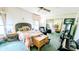 Comfortable bedroom with a ceiling fan and an abundance of natural light at 6305 Bayberry Ne Blvd, Winter Haven, FL 33881
