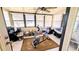 Enclosed sunroom filled with natural light, a ceiling fan, and versatile space for various activities at 6305 Bayberry Ne Blvd, Winter Haven, FL 33881
