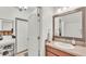 Bathroom with vanity and decorative mirror and nearby linen closet provides optimal storage at 6343 Torrington Cir, Lakeland, FL 33811