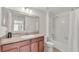 Well-lit bathroom featuring a tub-shower combination and a neutral-toned vanity with ample counter space at 6343 Torrington Cir, Lakeland, FL 33811