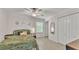 Comfortable bedroom with a ceiling fan, closet, and natural light creating a cozy ambiance at 6343 Torrington Cir, Lakeland, FL 33811