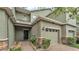Charming townhome featuring a one car garage and inviting brick paver entry walkway, with lush landscaping at 6343 Torrington Cir, Lakeland, FL 33811