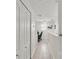 Upstairs hallway featuring a desk, linen closet and neutral color palette at 6343 Torrington Cir, Lakeland, FL 33811
