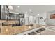 Stylish kitchen features black cabinetry, granite countertops, and stainless steel appliances at 6343 Torrington Cir, Lakeland, FL 33811