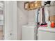 Functional laundry area with washer, dryer, and overhead storage, ready for easy chores at 6343 Torrington Cir, Lakeland, FL 33811
