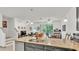 Open-concept layout with kitchen island overlooking the living area, seamlessly connects to the outdoor patio at 6343 Torrington Cir, Lakeland, FL 33811