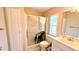 Clean bathroom with glass enclosed shower, tile flooring, and ample storage at 6562 Chinaberry Ne Dr, Winter Haven, FL 33881