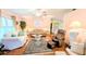 Cozy living area featuring hardwood floors, comfortable sofas and accent rug at 6562 Chinaberry Ne Dr, Winter Haven, FL 33881