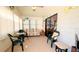 Bright sunroom with plenty of natural light, ceiling fan, comfortable furniture and a view of the outdoors at 6562 Chinaberry Ne Dr, Winter Haven, FL 33881
