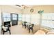 Bright sunroom with plenty of natural light, ceiling fan, comfortable furniture and a view of the outdoors at 6562 Chinaberry Ne Dr, Winter Haven, FL 33881