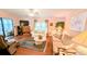 Comfortable living area with sofas, TV, and access to enclosed lanai at 6562 Chinaberry Ne Dr, Winter Haven, FL 33881