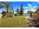 A spacious backyard features a playset, a firepit, and a paved space with a patio table at 7120 Summit Dr, Winter Haven, FL 33884