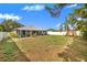 The fully-fenced backyard includes a playset and an open canvas to make it your own oasis at 7120 Summit Dr, Winter Haven, FL 33884