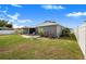 Spacious backyard with a fire pit and cozy patio area that offers a tranquil outdoor living space at 7120 Summit Dr, Winter Haven, FL 33884