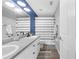Double sink bathroom featuring modern fixtures, vanity with white cabinets, and a tub at 7120 Summit Dr, Winter Haven, FL 33884