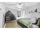 Bedroom featuring modern decor, a ceiling fan, and light hardwood flooring at 7120 Summit Dr, Winter Haven, FL 33884