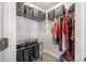 Organized walk-in closet with wire shelving, storage baskets, and clothes racks for optimal storage at 7120 Summit Dr, Winter Haven, FL 33884