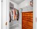 Well-organized closet featuring wire shelving and a wooden dresser for ample storage space at 7120 Summit Dr, Winter Haven, FL 33884