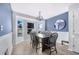 Dining room featuring a bay window, a modern chandelier, and a decorative mirror at 7120 Summit Dr, Winter Haven, FL 33884