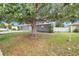 A beautiful shade tree stands tall in the front yard, and the property is surrounded by a privacy fence at 7120 Summit Dr, Winter Haven, FL 33884