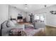 Comfortable living room with vaulted ceilings, wood floors, and stylish decor at 7120 Summit Dr, Winter Haven, FL 33884