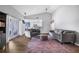 Bright living room with vaulted ceilings, wood flooring, and a comfortable seating arrangement at 7120 Summit Dr, Winter Haven, FL 33884