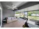 The screened patio is a versatile space with exercise equipment and comfortable seating, perfect for leisure at 7120 Summit Dr, Winter Haven, FL 33884