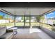 Relaxing screened patio area offers seamless indoor-outdoor living with comfortable seating and views of the backyard at 7120 Summit Dr, Winter Haven, FL 33884