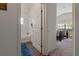 A bathroom features a shower over the bath with a curtain next to a toilet and sink at 799 Highland Crest Loop, Lake Wales, FL 33853
