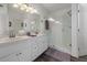 Bathroom with a double vanity, a lighted mirror and a walk-in shower at 799 Highland Crest Loop, Lake Wales, FL 33853
