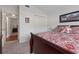 View of bedroom with a double bed and doorway leading to an adjacent bedroom at 799 Highland Crest Loop, Lake Wales, FL 33853