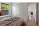 View of bedroom with double closet, large window and neutral decor at 799 Highland Crest Loop, Lake Wales, FL 33853