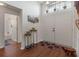 Inviting foyer featuring hardwood floors, double doors, and a view of the bathroom down the hall at 799 Highland Crest Loop, Lake Wales, FL 33853