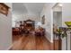 Cozy living room with hardwood floors, vaulted ceilings, a vintage rocking chair and entertainment center at 799 Highland Crest Loop, Lake Wales, FL 33853