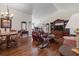 Spacious living area featuring hardwood floors, comfortable furniture, and bright natural light at 799 Highland Crest Loop, Lake Wales, FL 33853