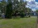 View of the expansive backyard with a storage shed at 803 7Th Ne St, Fort Meade, FL 33841