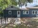 Backyard featuring mature trees, privacy fencing, and convenient access to the house at 803 7Th Ne St, Fort Meade, FL 33841