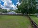 Expansive backyard featuring a well-maintained lawn and a sturdy wooden fence at 803 7Th Ne St, Fort Meade, FL 33841