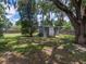 Spacious backyard with green grass and a storage shed at 803 7Th Ne St, Fort Meade, FL 33841