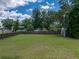 Large backyard with expansive lawn and storage shed at 803 7Th Ne St, Fort Meade, FL 33841