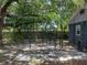 Spacious backyard featuring a fenced-in pet enclosure and mature trees at 803 7Th Ne St, Fort Meade, FL 33841