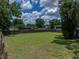 Fenced backyard featuring a well-maintained lawn, offering privacy and space at 803 7Th Ne St, Fort Meade, FL 33841